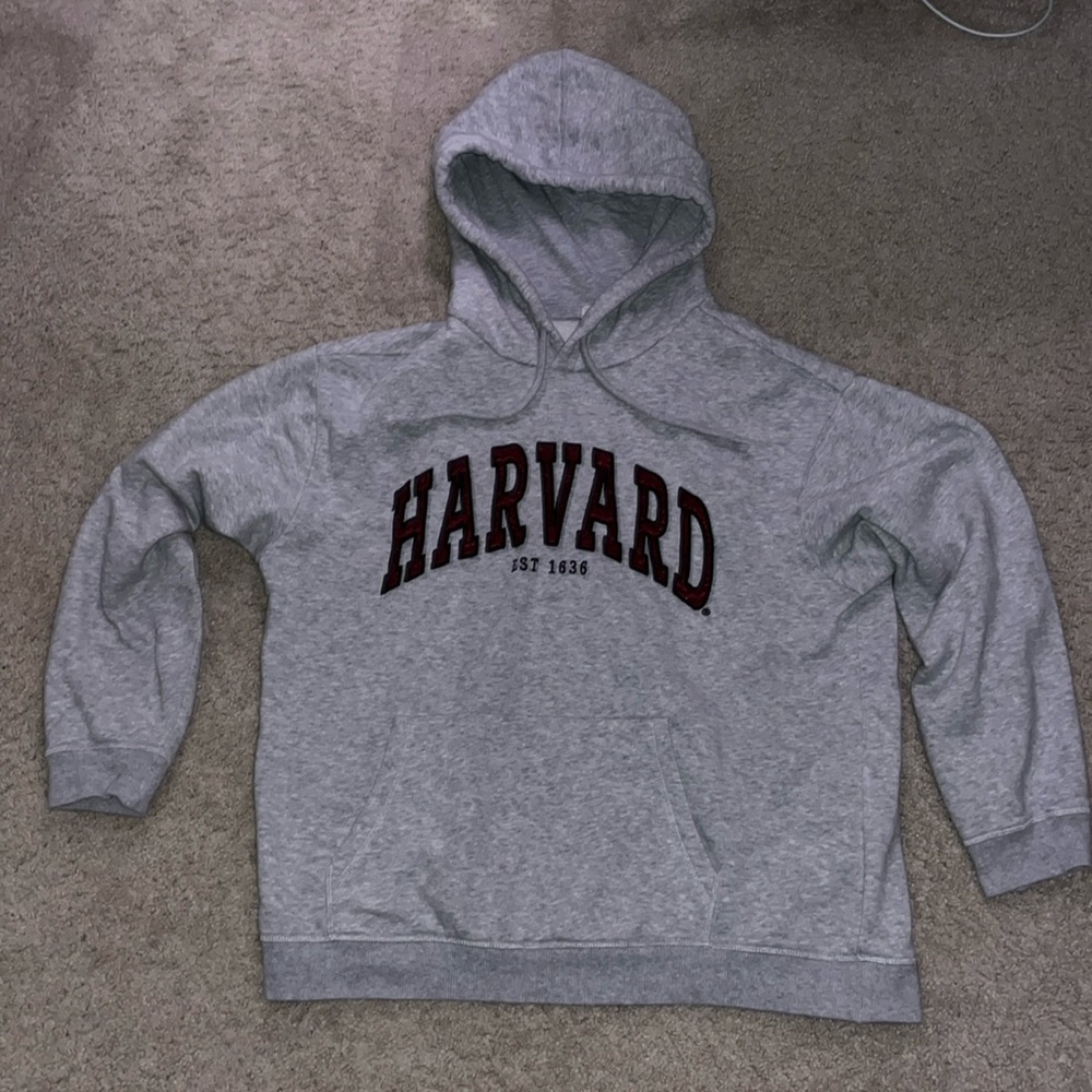 Grey hoodie, written with Harvard in dark red.